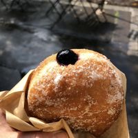 Blueberry jelly filled vegan donut before biting in!  at Donut Shop in Prague