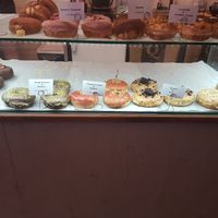 The whole bottom shelf is vegan at Donut Shop in Prague