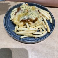 Poutine appetizer   at Kyushu Jangara Ramen - Harajuku in Tokyo