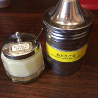 Garlic and sesame seeds placed at each seat. at Kyushu Jangara Ramen - Harajuku in Tokyo