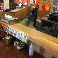 This is inside the restaurant. It's small but it works. There are bolted-in stools arranged around the bar, as well as a few small tables.  at Kyushu Jangara Ramen - Harajuku in Tokyo