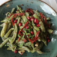 Green bean salad with dried tomatoes, walnuts, pomegranate at Daredzhani in Almaty