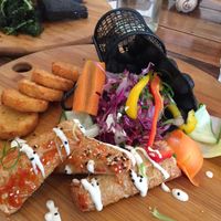 Charcoal bubble waffles with a side of hash browns at Handsome Her in Brunswick