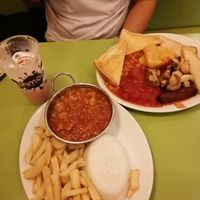 Cooked breakfast and veg curry and chips.  at Beach House Cafe in Great Yarmouth