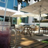 the outside area is quiet and nice. at Organic Caffe in Estoril