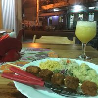 Tofu kebab, farofa, rice, potato, and suco at Naturalize Bistro Vegetariano in Manaus