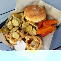 Burger, onion rings, pickle chips, and buffalo tempeh tenders at E Burger in Columbus