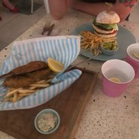 Banana leaf fish and chips and a burger  at Kynd Community - Seminyak in Seminyak