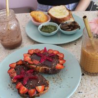 Delicious toasts: one savoury (custom), one sweet (Einstein)! Also pictured is an iced caramel latte (with coconut milk), and an Oreo milkshake! Amazing :) at Kynd Community - Seminyak in Seminyak