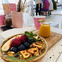 Green bowl and turmeric shot   at Kynd Community - Seminyak in Seminyak