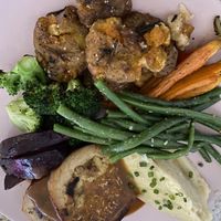 Vegan “Cheekan” Sunday Roast. Cranberry sauce and extra gravy not featured.  at Kynd Community - Seminyak in Seminyak