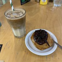 Iced latte and chocolate doughnut   at Cafe Thrive in Southampton