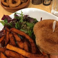 Veggie burger (it was unreal) sweet potato fries, salad and onion rings at Cafe Thrive in Southampton