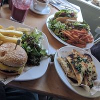 The 'Meaty' Burger (Bottom left) and Very Berry Purple Smoothie (Top left); Garlic Bread (bottom right) and 'TLT' Thrive Sandwich (top right) at Cafe Thrive in Southampton