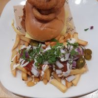 Seitan chicken burger with loaded chips at Cafe Thrive in Southampton