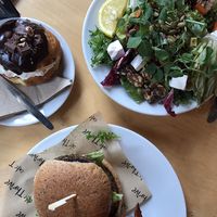 Lentil burger with sweet potato chips, beetroot, walnut and “feta” salad and cream filled donut at Cafe Thrive in Southampton