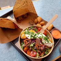 half of Vienna burger for me and my husband, chili sauce, nugget salad, and cheese bites at Swing Kitchen - Kaiserfeldgasse in Graz