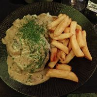Grilled Seitan Steak with Garlic Rice, triple cooked Chips and a rich Mushroom Coffee Cream Sauce at Veginity in Dublin