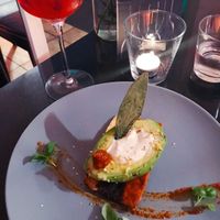 Steamed avocado with crispy tofu smoked bacon, almond cream cheese with spicy harissa sauce and sage.  at Veginity in Dublin