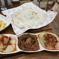 Fries and "salad trio" (hummus, muhammara and mutabbal with bread) at Zatar Pizza in Yerevan