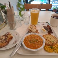 Assiette English Breakfast, almond croissant, freshly pressed orange juice, and a cup of tea at Comptoir Veggie in Paris