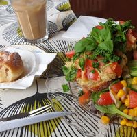 Hummus sandwich, ice latte and half eaten cinnamon bun at Café Nowhere in Enskede