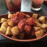 Cubed chips with spicy tomato sauce. at Revolucion de Cuba in Norwich