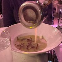 Potato soup (mid pour)  at P.S. Kitchen in New York City