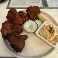 Miatake mushrooms with buffalo sauce, blue cheese, and potato saladd  at P.S. Kitchen in New York City