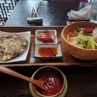 Bibimbap set meal. Red lepepper sauce, salad, kimchi, soy dip, green onion pancake (small) at Minari in Kyoto