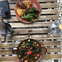 Vegan ShakShuka on the bottom.  Omnivore’s eggs Benedict on the top. at Zenith in Porto