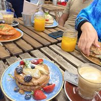 In Front the vegan pancake and caramel latte with almond milk at Zenith in Porto
