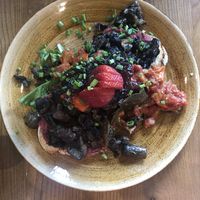 Beetroot hummus toast with mushrooms, tomatoes and chutney at Zenith in Porto