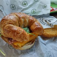 Croissant, egg, cheese, bacon at Plant Power Fast Food - Encinitas in Encinitas