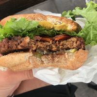 The Classic Burger with a beefy patty at Plant Power Fast Food - Encinitas in Encinitas