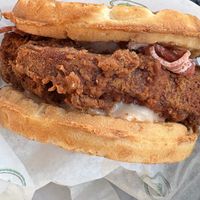 Chicken and waffle sandwich (vegan chicken patty, vegan bacon, and maple aioli all between two waffle buns) at Plant Power Fast Food - Encinitas in Encinitas