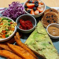 Vegan brunch: blueberry pancakes with salted caramel mousse, avocado toast, scrumbled tofu and fresh fruit  at Shake Cafe - Del Corso in Florence