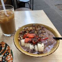 Chocolate smoothie bowl and iced coffee w oat milk at Shake Cafe - Del Corso in Florence
