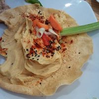 Hummus with crudités (celeric, carrot and pepper) garnish with black sesame seeds. at Fusiona Gastrobar in Merida