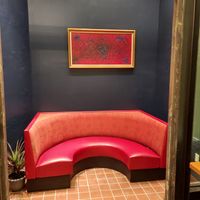 Cosy red settee for lovers of vegan food at Green at Green Vegetarian Cuisine - Quarry Market in San Antonio