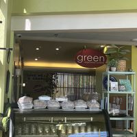 Bakery case with huge cinnamon roll deliciousness stacked on top  at Green Vegetarian Cuisine - Quarry Market in San Antonio