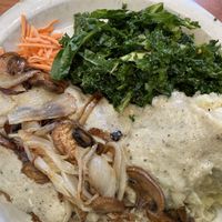 Chick’n fried steak with added mushrooms and onions, mashed potatoes, kale saladd  at Green Vegetarian Cuisine - Quarry Market in San Antonio