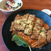 Eggplant Parmesan with a small side salad topped with Poblano ranch. at Green Vegetarian Cuisine - Quarry Market in San Antonio