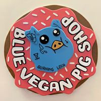 Company’s logo #Veganuary at Blue Vegan Pig Shop in Prague