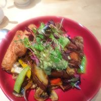 Potatoes with extra avocado and vegan sausage at The Orchard Cafe in Worthing
