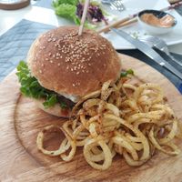 Vegan burger with curly fries. at Elephant in the Room in Thessaloniki
