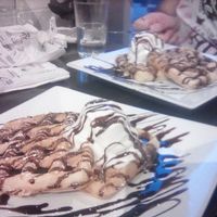 Waffle stack with chocolate sauce and ice cream at güd eats in Saskatoon
