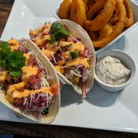 avo-shiitake tacos and small order of onion rings with dilly ranch dip at güd eats in Saskatoon