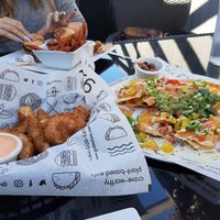 Those nachos and coconut shrimps. Omg. at güd eats in Saskatoon