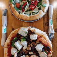 Personal pizzas: white pizza and a create your own. The blobs of cashew cheese are heavenly! at Pulse Cafe in Hadley